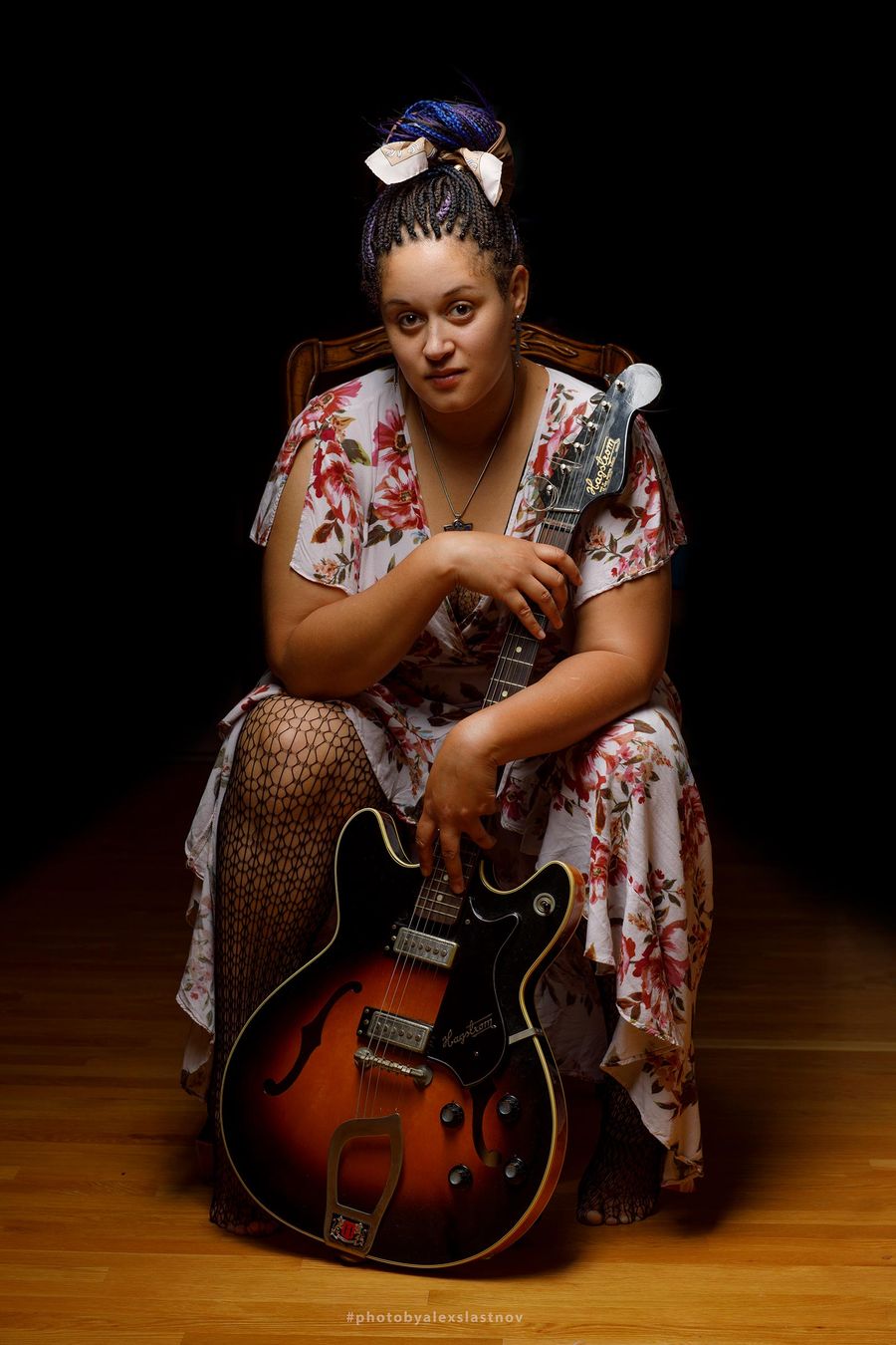 Studio portrait of a woman seated with a vintage hollow-body guitar, Boston portrait photographer