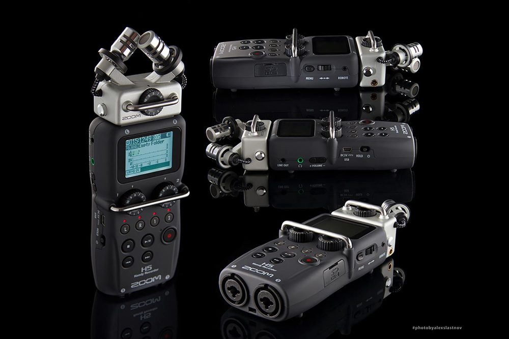 Product photography of a portable audio recorder shown from several angles on a black reflective surface